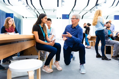 Apple CEO Tim Cook speaking with students during a conference in San Jose, Calif. in 2019.